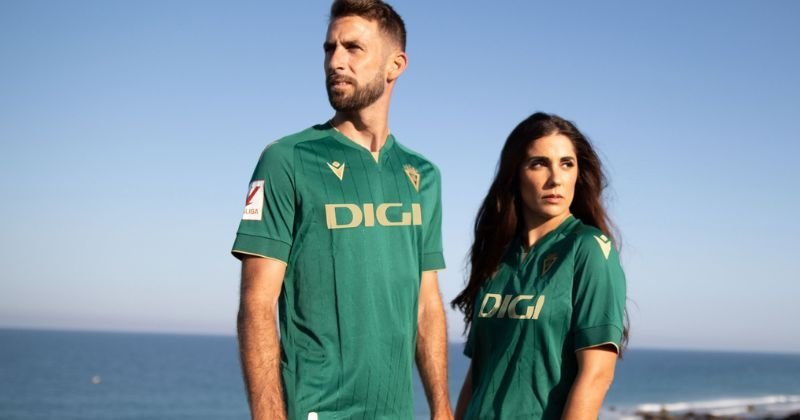 models wearing cadiz 2023-24 third shirt in green and gold